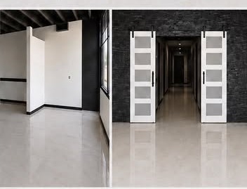 White barn-style doors and dark accent wall inside The 5Eleven Venue