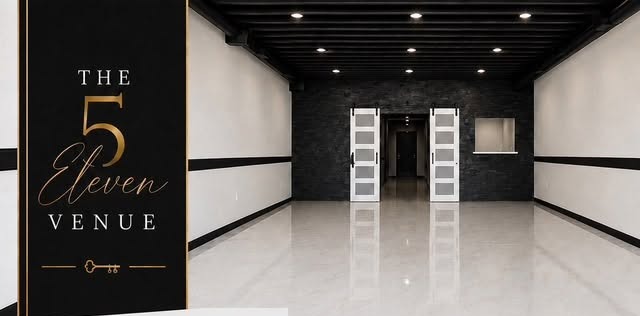 Open event space with polished floors and black ceiling in South Houston